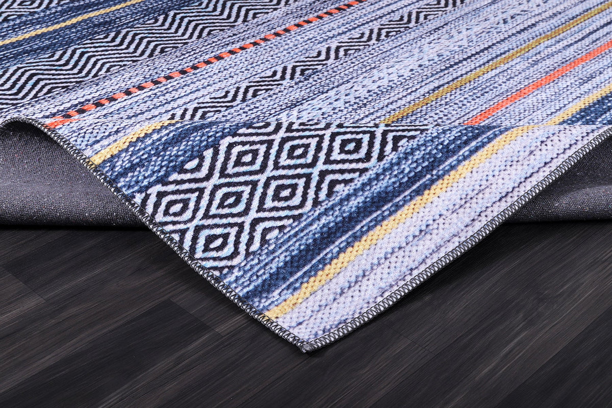 Détail du motif du tapis abstrait bleu marine lavable Isée